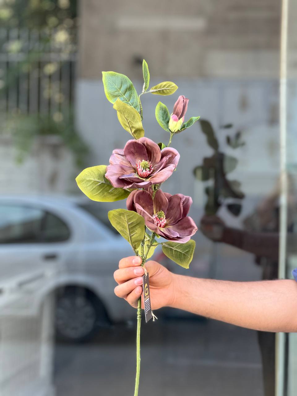 شاخه گل مصنوعی مگنولیا 2گل و یک غنچه رنگ بادمجونی
